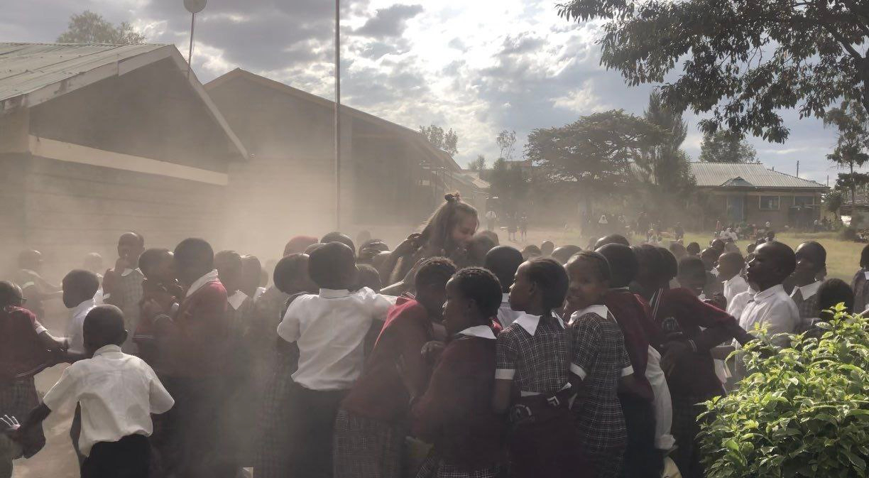 When I went to visit a friend in a another school, and all the children came out to hug me.  